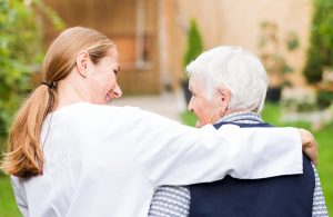 caregiver and elderly woman