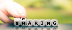 Dice form the words "caring" and "sharing".